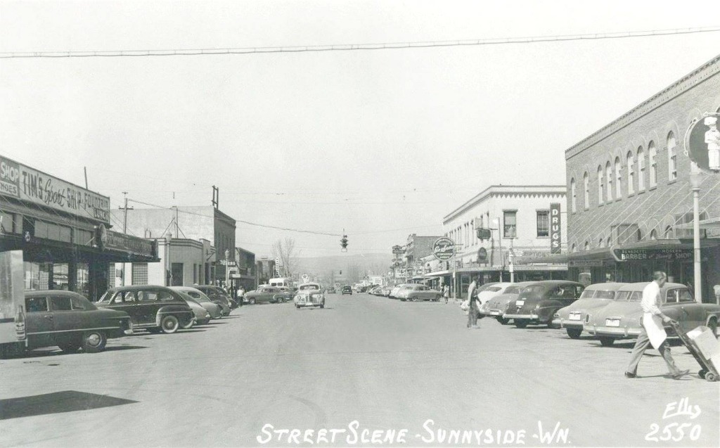 1950s Looking North on 6th Street Tims Sport Shop, Texaco & Drug Store